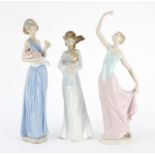 Three Nao figurines including a mother and child, the largest 35cm high :For Further Condition