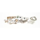 Silver and white metal jewellery including a charm bracelet, rings and a cameo bracelet, 134.0g :For