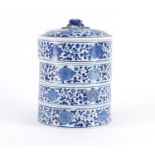 Chinese blue and white porcelain four section pot and cover, decorated with flower heads and