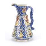 Turkish Kutahya pottery jug hand painted with stylised flowers, 22cm high :For Further Condition