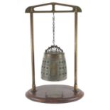 Antique Sino-Tibetan bronze temple bell on later stand, overall 64cm high, the bell 22cm high :For