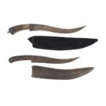 Two Islamic Afghan Pesh Kabz daggers with sheaths, bone handles and engraved steel blades, the