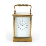 Large French brass cased carriage clock by Angelus, the enamelled dial with Roman and Arabic