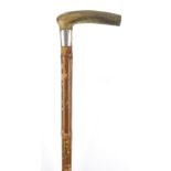 Horn handled walking stick with silver collar and bamboo shaft, probably rhinoceros horn, 89.5cm
