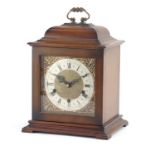 Smiths Westminster chiming bracket clock striking on three rods, with silvered chapter ring having