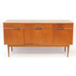 Vintage teak sideboard with three drawers above a central fall and pair of cupboard doors, 80cm H