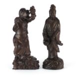 Two Chinese hardwood carving including an example of Guanyin holding a basket of fish, the largest