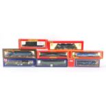 OO gauge model railway with boxes including Hornby locomotive, Lima railcar and mainline railway