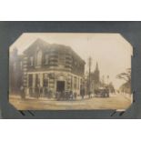 Edwardian and later topographical and social history postcards arranged in an album, some black