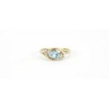 9ct gold blue stone and diamond crossover ring, size M, 2.1g :For Further Condition Reports Please