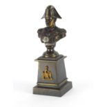 Patinated bronze bust of Napoleon Bonaparte, raised on a square tapering base, overall 26cm high :