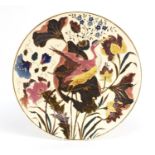 Continental porcelain charger probably by Zsolnay Pecs, hand painted with a crane amongst flowers,