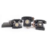 Three vintage black Bakelite telephones including a pyramid example, the largest 20cm high :For