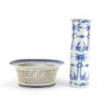 Chinese blue and white porcelain comprising a pierced basket and sleeve vase hand painted with