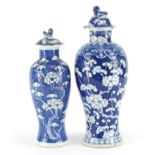 Two Chinese blue and white porcelain baluster vases and covers, hand painted with prunus flowers,