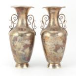 Pair of Chinese silver vases with twin handles, each engraved with figures and cranes, character