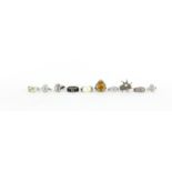 Ten silver rings, some set with semi precious stones and enamel, various sizes, 70.8g :For Further