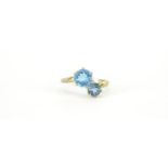 9ct gold blue stone crossover ring, size T, 2.7g :For Further Condition Reports Please Visit Our