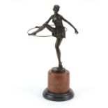 Large patinated bronze figure of an Art Deco semi nude hula hoopist after D Alonzo, raised on a