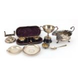 Silver items including a three footed sauce boat, Chinese coin dish, pair of salts in a fitted