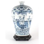 Chinese blue and white Meiping vase raised on carved hardwood stand, the vase hand painted with