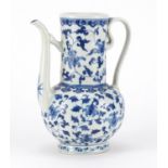 Chinese blue and white porcelain wine jug, hand painted with flowers and foliage, six figure