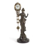 Bronze swinging clock in the form of an Art nouveau female, 34.5cm high :For Further Condition