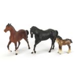 Three Beswick horses, including Black Beauty, the largest 20cm high :For Further Condition Reports