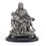 Large silver filled model of Pietà after Michelangelo Buonarroti, raised on an oval ebonised base,
