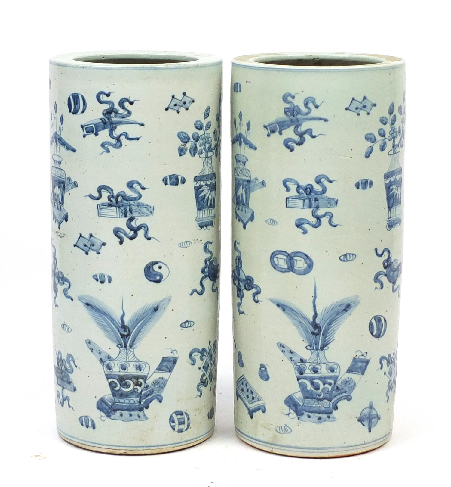 Pair of Chinese blue and white porcelain floor standing vases, hand painted with precious objects,