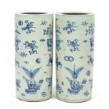 Pair of Chinese blue and white porcelain floor standing vases, hand painted with precious objects,