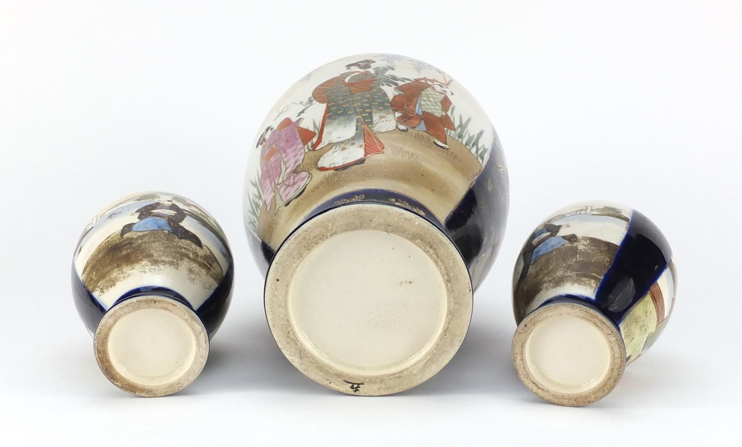 Three Japanese Satsuma pottery vases including a pair, each hand painted with flowers, the largest - Image 3 of 3