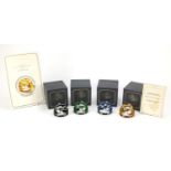 Set of four limited edition Baccarat cameo glass paperweights, with certificates and boxes