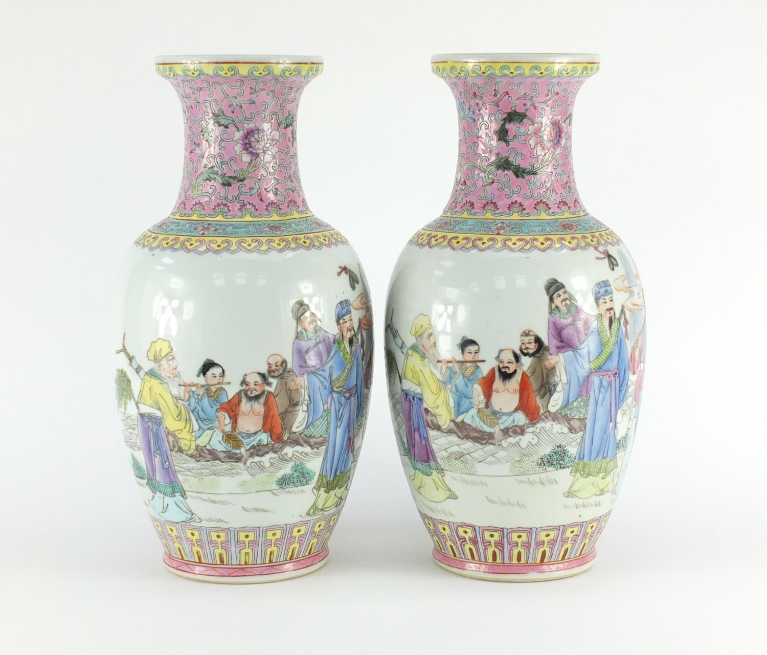 Pair of Chinese porcelain vases, each finely hand painted in the famille rose palette with figures