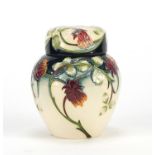 Moorcroft pottery ginger jar and cover, hand painted in the Meadow Charm pattern, dated 2003, 11cm