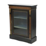 19th century French ebonised pier cabinet with geometric inlay and ornate gilt mounts, enclosing two