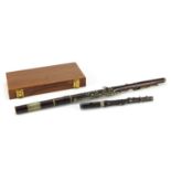 Victorian rosewood five piece flute and one other, the larger 65.5cm in length :For Further