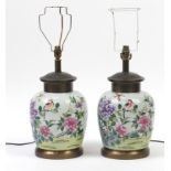 Pair of Chinese porcelain lamps hand painted in the famille rose palette with birds amongst flowers,