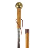 Leather bound sword stick with brass pommel and engraved steel blade, 93cm in length :For Further