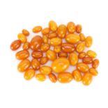 Butterscotch amber coloured beads, the largest 2.8cm in length, 82.0g :For Further Condition Reports