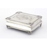 Rectangular silver jewel box by William Comyns, the hinged lid embossed with maidens, putti, swags