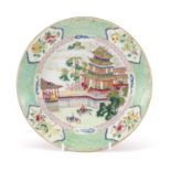 Good Chinese porcelain plate, finely hand painted in the famille rose palette with figures outside