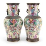 Pair of Chinese crackle glazed vases with twin handles, each finely hand painted in the famille rose