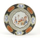 Chinese porcelain plate, finely hand painted in the famille rose palette with two young girls within