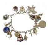 Silver charm bracelet with a selection of mostly silver charms including enamelled shields and