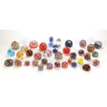 Colourful glass paperweights including Mdina and Millefiori design examples, the largest 11.5cm high