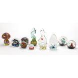 Twelve colourful glass paperweights including Selkirk, S J Penn-Smith, Caithness and Mdina, the