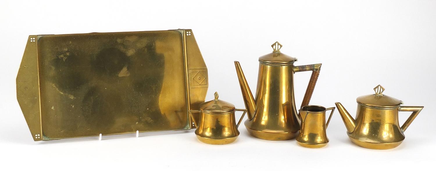 Arts & Crafts brass four piece tea service on tray possibly German, the tray 37cm wide :For