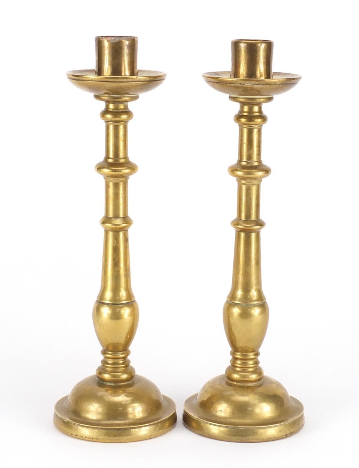 Pair of antique continental bronze candlesticks, each 31.5cm high :For Further Condition Reports