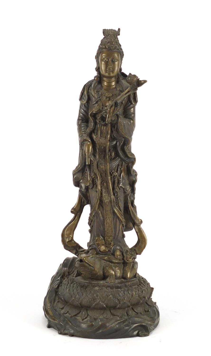 Chinese bronze figure of Guanyin standing on a toad and lotus leaf, 33cm high :For Further Condition